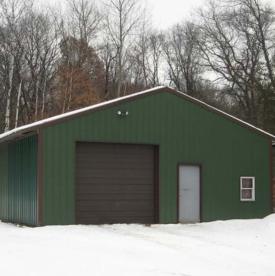 Landscape of Green Garage Structure Representing First Quality Tools Services Headquarters