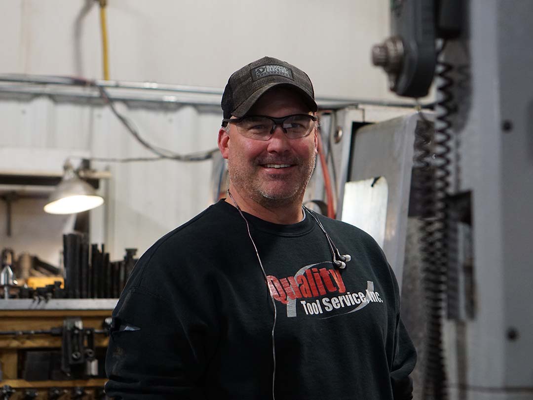 Portrait of Man Signing off To Do s on A Board After Inspecting Machines from Quality Tools Service